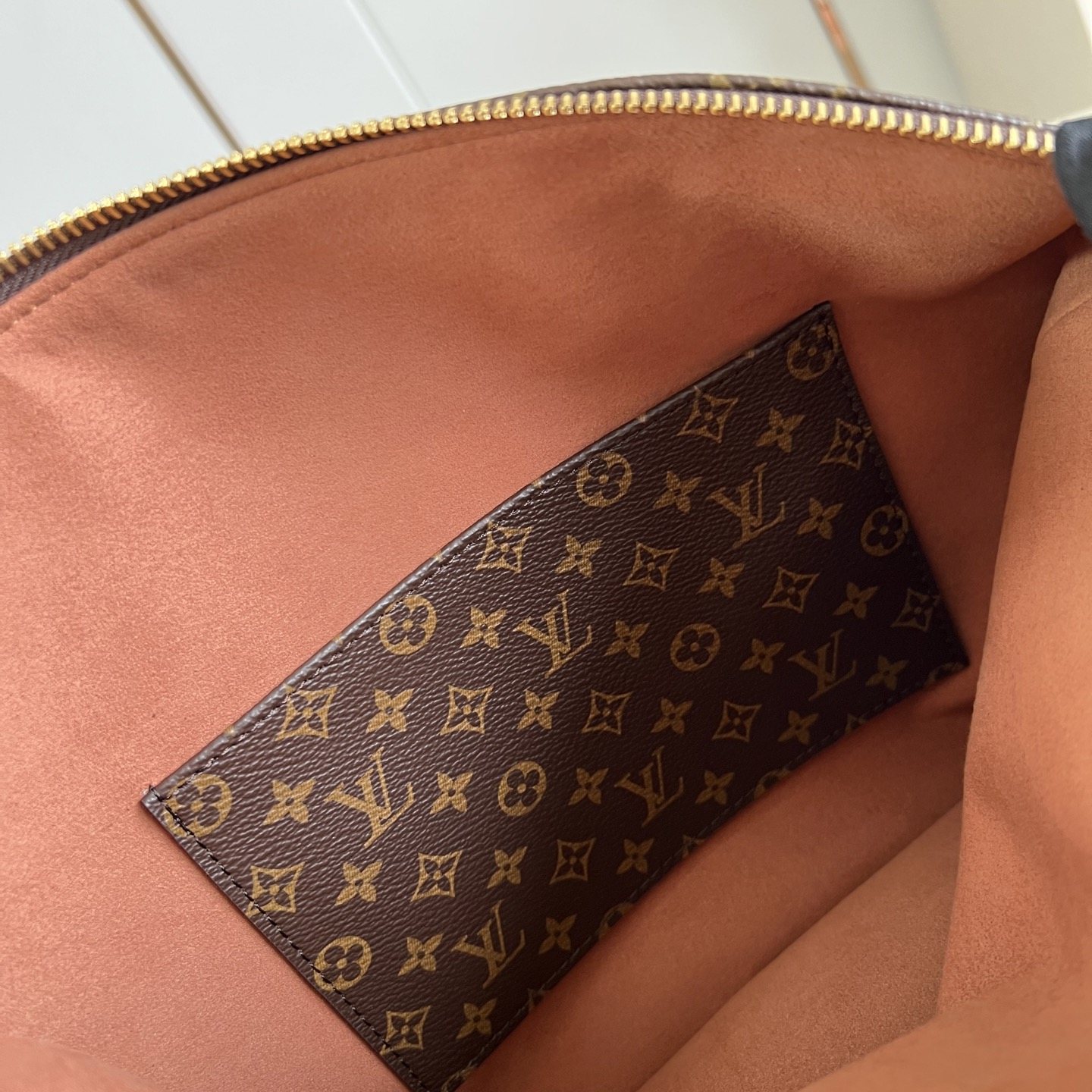 Louis Vuitton Neo Lockit in Monogram Canvas with Vachetta Leather Trim and Zipper for Handheld Carry
