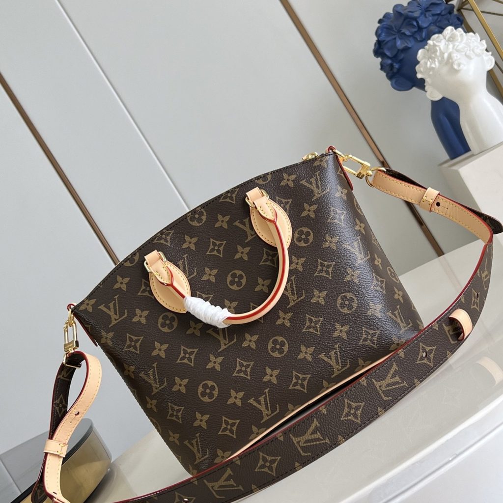 Louis Vuitton Neo Lockit in Monogram Canvas with Vachetta Leather Trim and Zipper for Handheld Carry