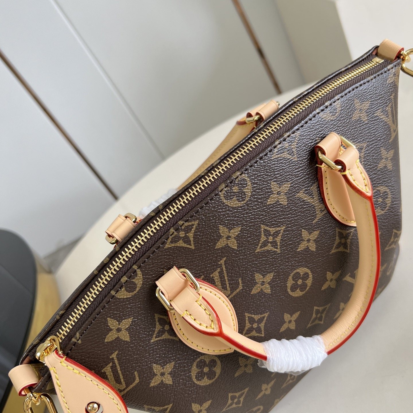 Louis Vuitton Neo Lockit in Monogram Canvas with Vachetta Leather Trim and Zipper for Handheld Carry