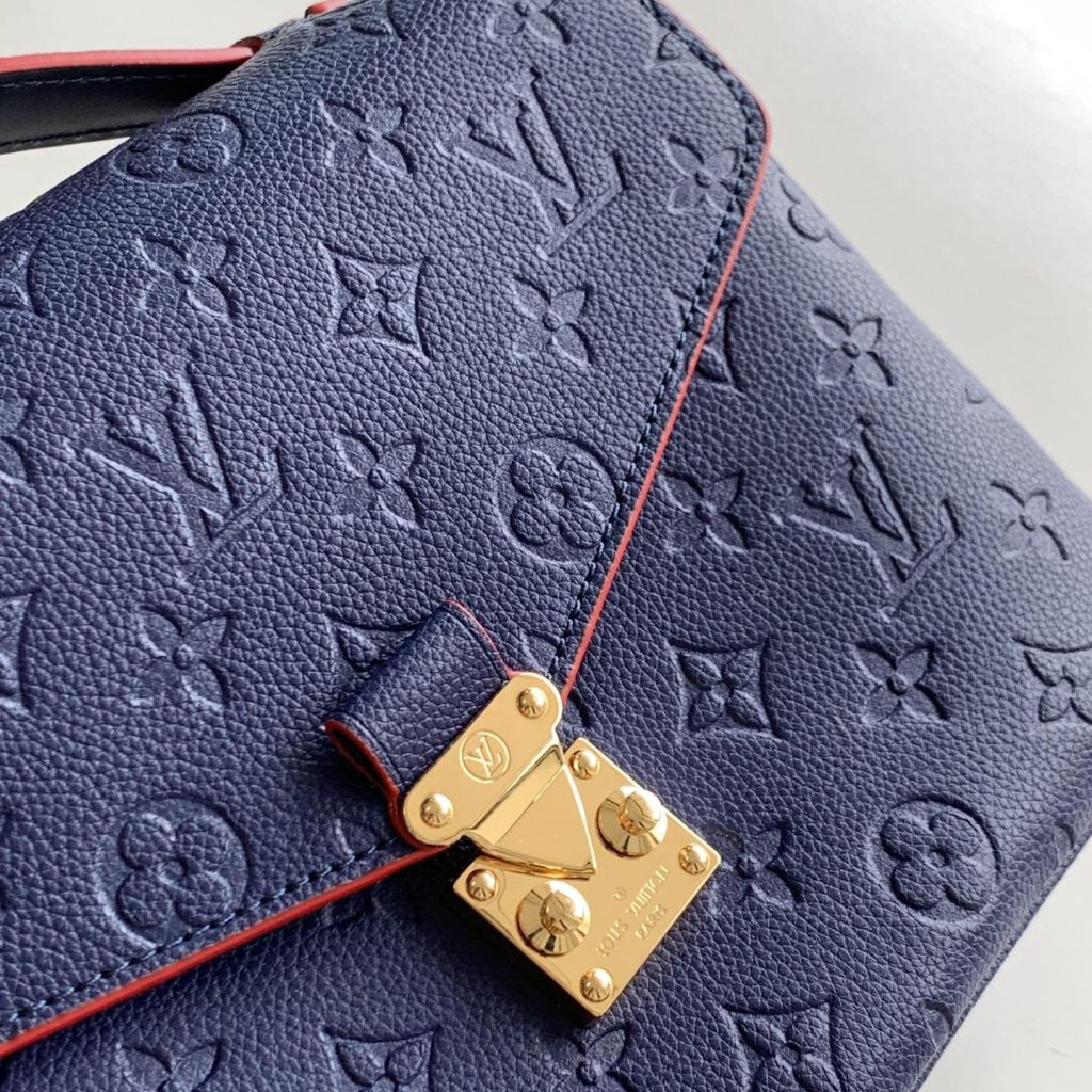 Louis Vuitton Pochette Métis in Monogram Empreinte Calfskin with Twist-lock Flap and Zipper Closure