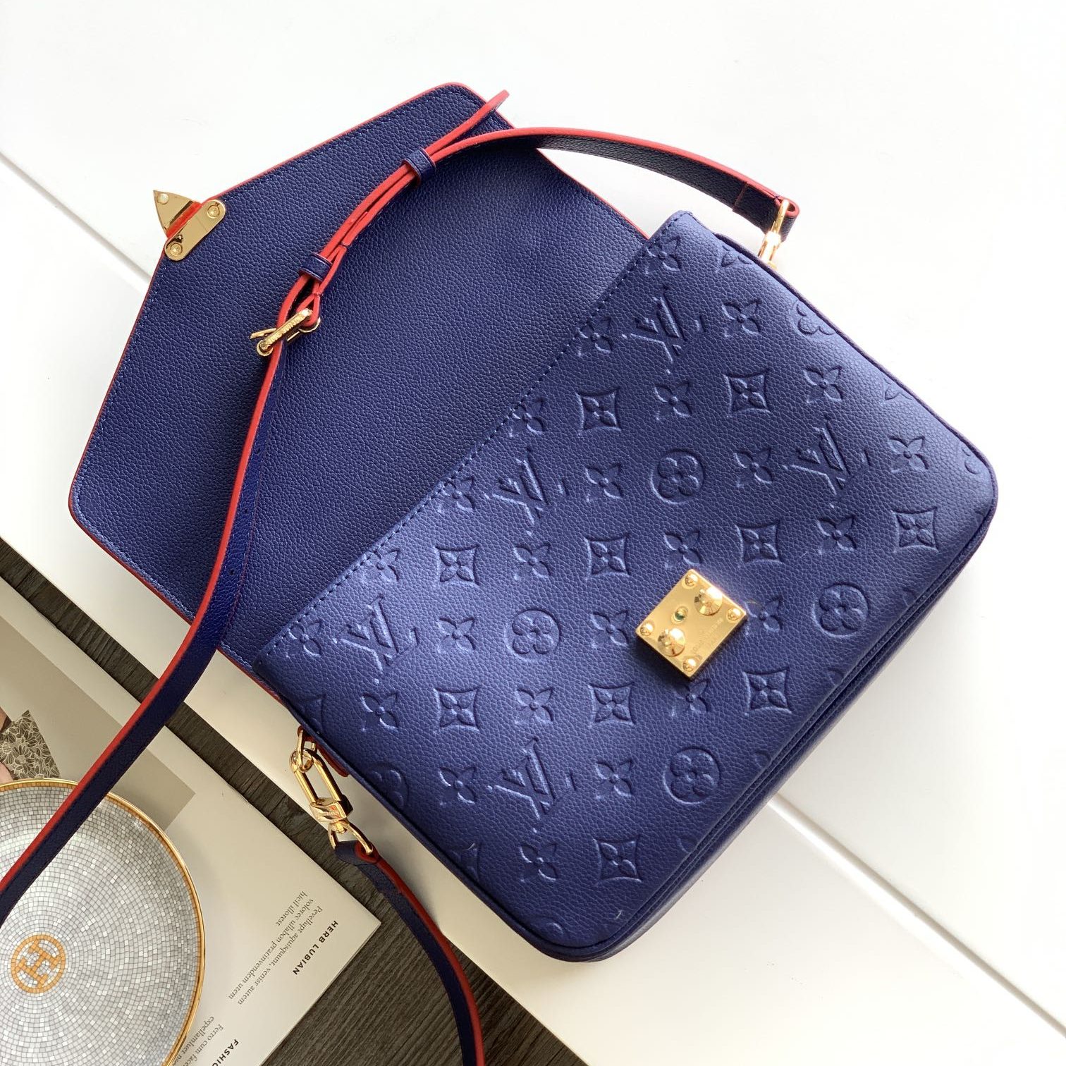 Louis Vuitton Pochette Métis in Monogram Empreinte Calfskin with Twist-lock Flap and Zipper Closure