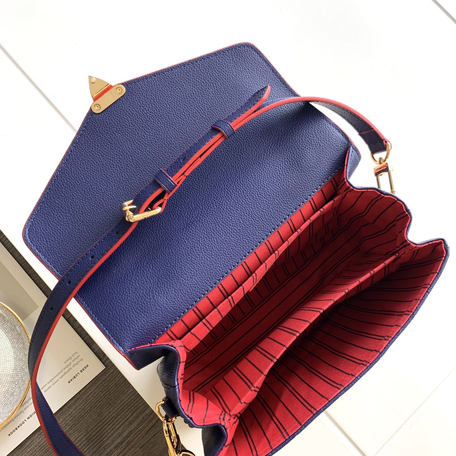 Louis Vuitton Pochette Métis in Monogram Empreinte Calfskin with Twist-lock Flap and Zipper Closure