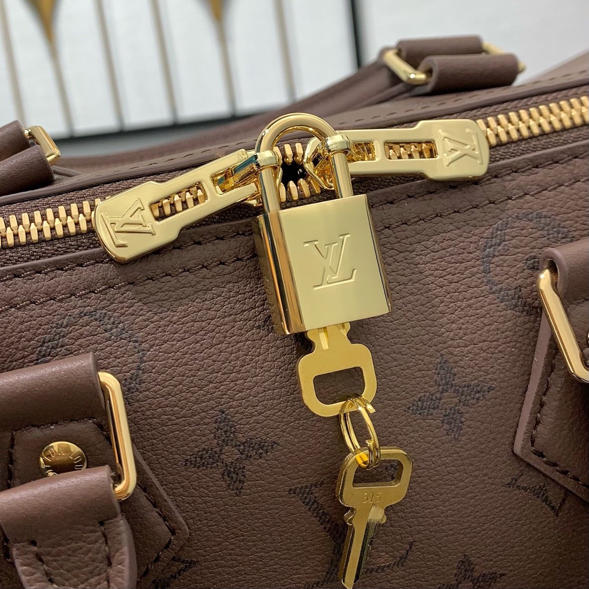 Louis Vuitton Speedy Bandoulière in Monogram Eclipse Grained Calfskin with Zipper Closure for Handhe