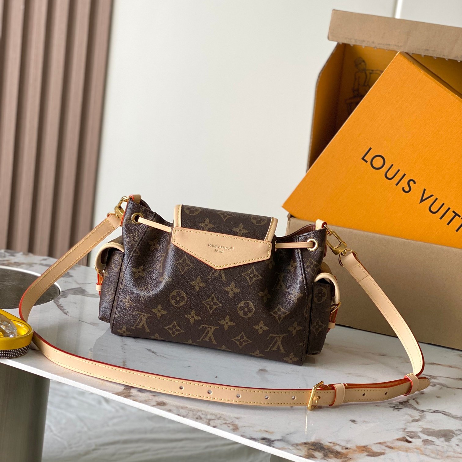 Louis Vuitton Odysée in Monogram Canvas with Drawstring and Flap for Shoulder Crossbody Carry