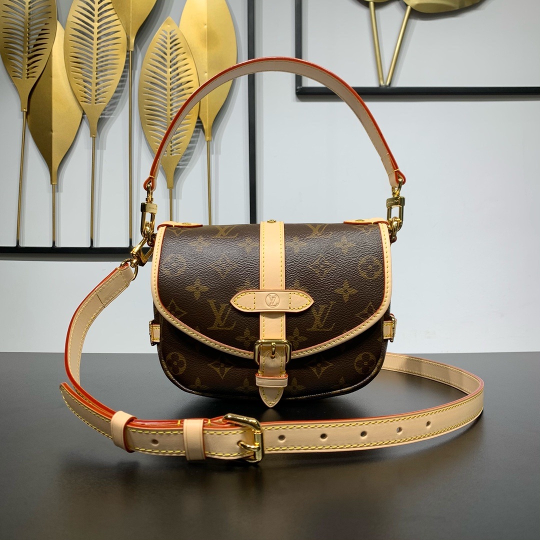Louis Vuitton Saumur in Monogram Canvas and Natural Leather with Flap Closure for Handheld Carry