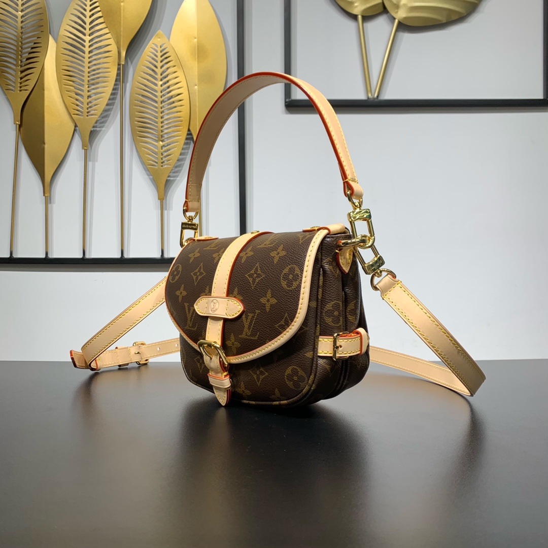 Louis Vuitton Saumur in Monogram Canvas and Natural Leather with Flap Closure for Handheld Carry