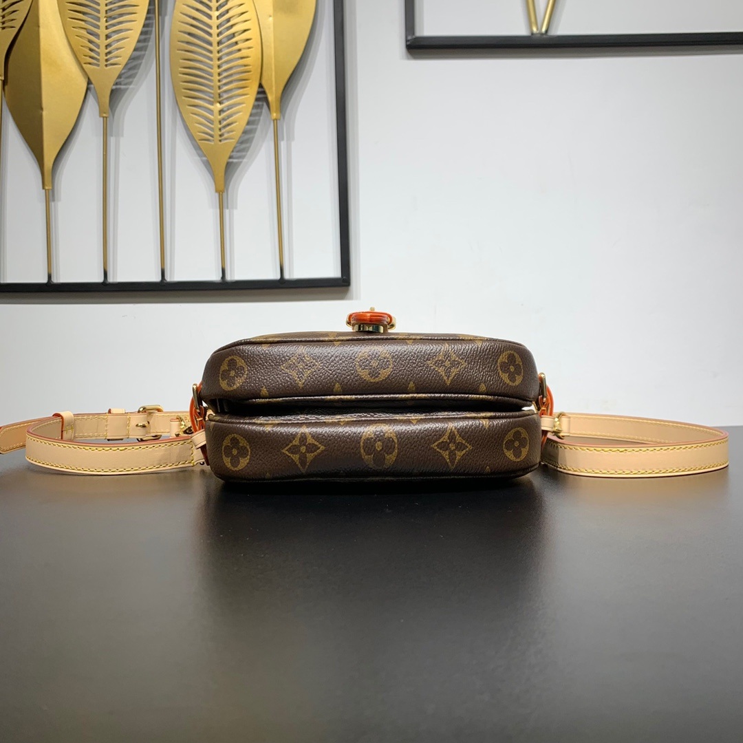 Louis Vuitton Saumur in Monogram Canvas and Natural Leather with Flap Closure for Handheld Carry