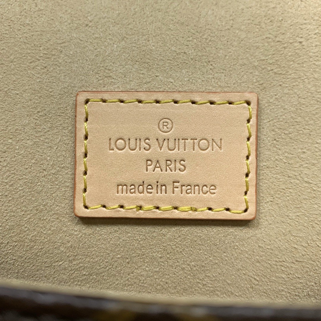 Louis Vuitton Saumur in Monogram Canvas and Natural Leather with Flap Closure for Handheld Carry