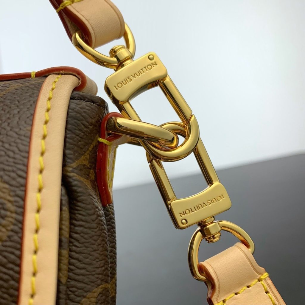 Louis Vuitton Saumur in Monogram Canvas and Natural Leather with Flap Closure for Handheld Carry