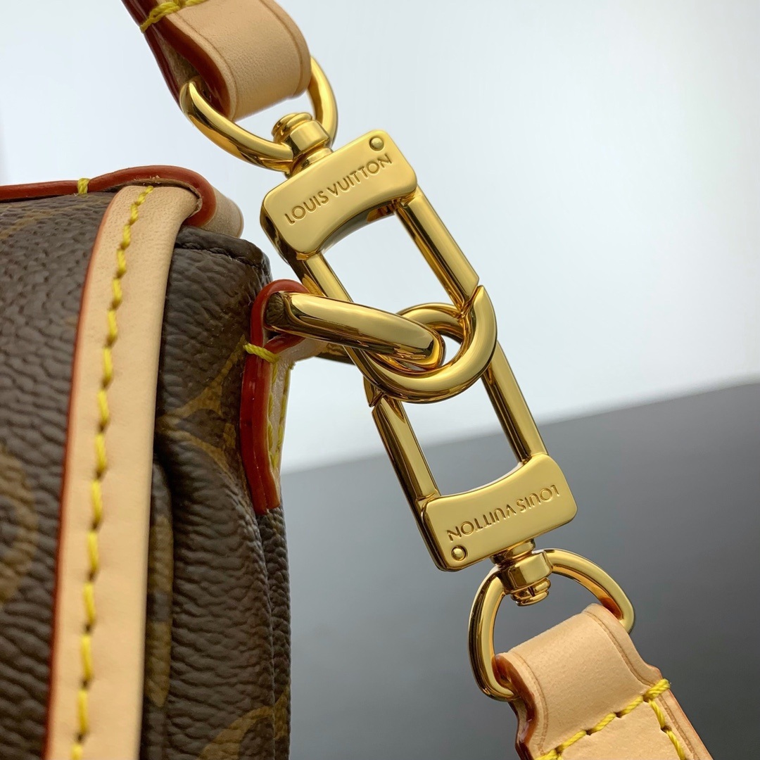Louis Vuitton Saumur in Monogram Canvas and Natural Leather with Flap Closure for Handheld Carry