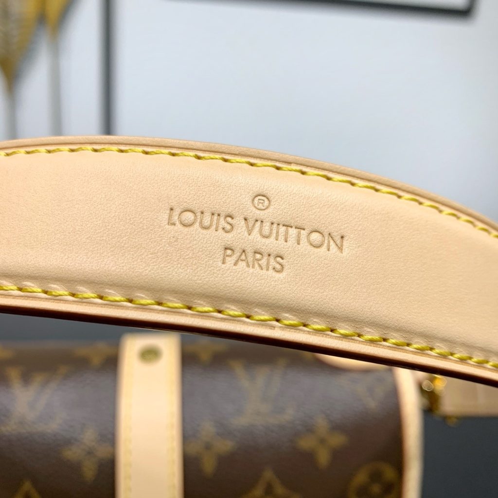 Louis Vuitton Saumur in Monogram Canvas and Natural Leather with Flap Closure for Handheld Carry