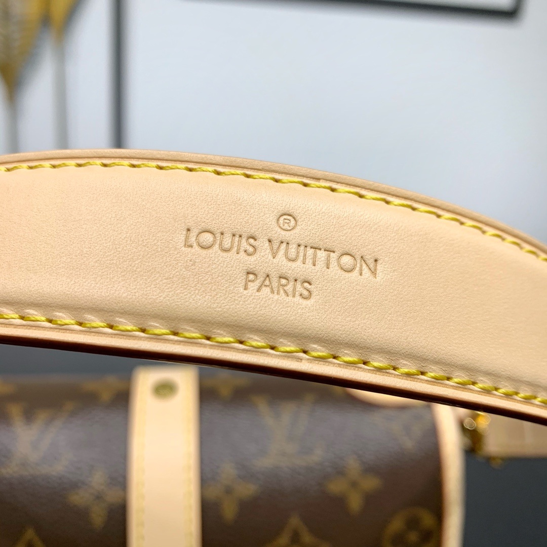 Louis Vuitton Saumur in Monogram Canvas and Natural Leather with Flap Closure for Handheld Carry