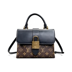 Louis Vuitton Locky BB in Monogram Canvas and Black Leather with Flap Closure for Handheld Carry