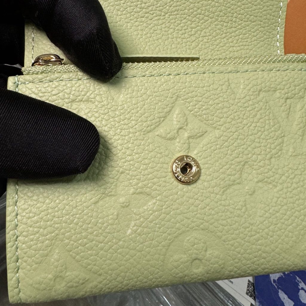 Louis Vuitton Rosalie in Monogram Empreinte Calfskin with Snap Button Flap Closure for Handheld