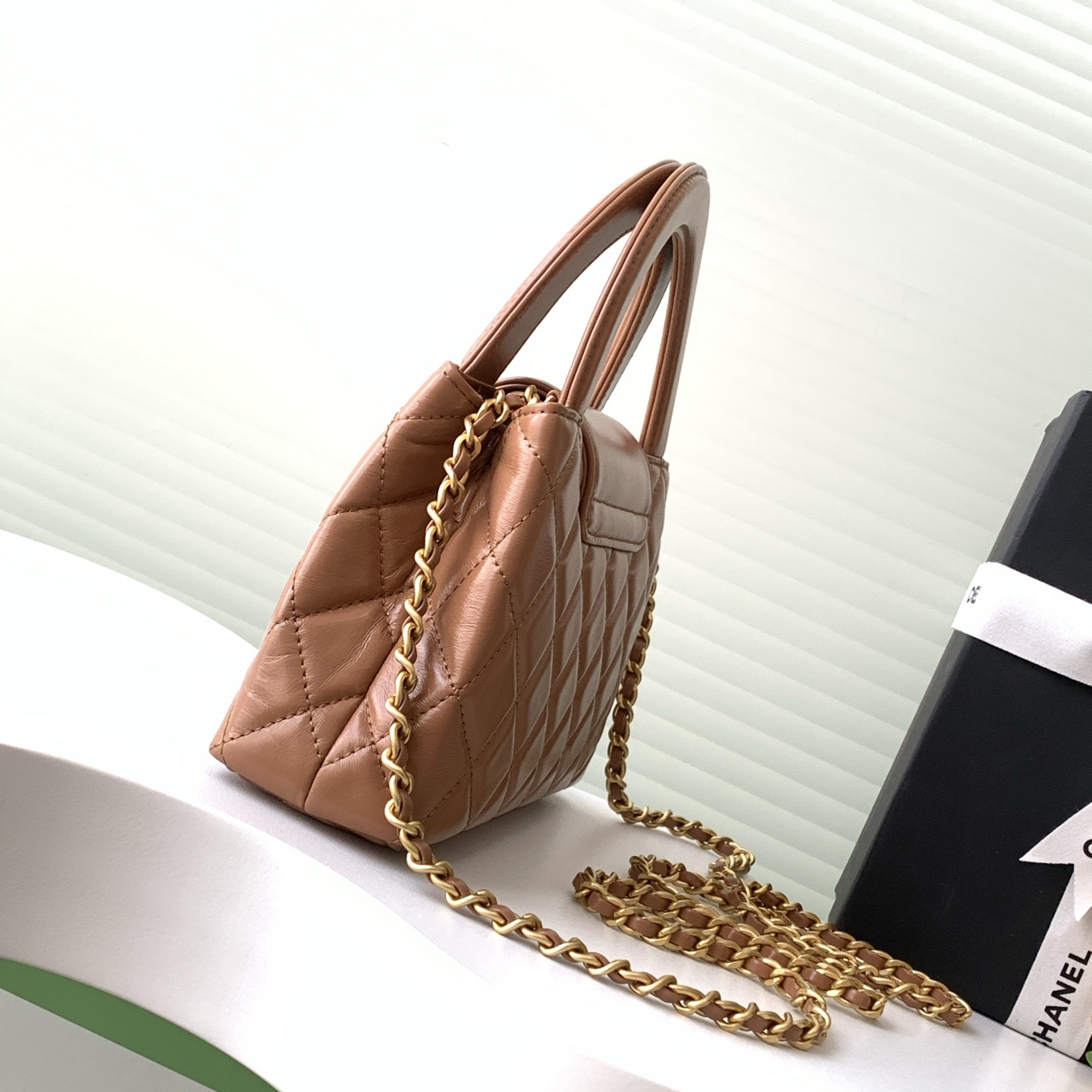 Chanel Kelly Top Handle in Caviar Leather with Turn-lock Flap Closure for Handheld and Shoulder