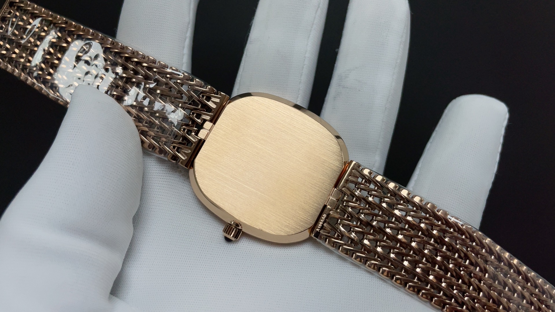 Patek Philippe Vintage Oval Watch, Silver Dial Rose-Gold Woven Bracelet